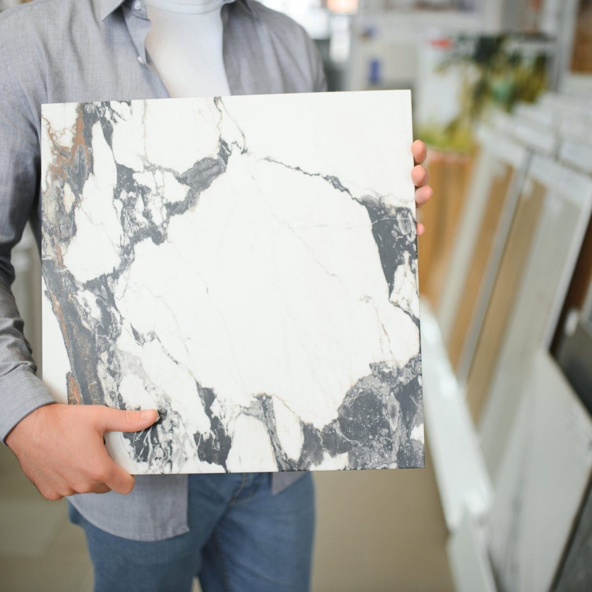 male-customer-choosing-kitchen-ceramic-tile-in-sto-2025-03-16-02-28-29-utc