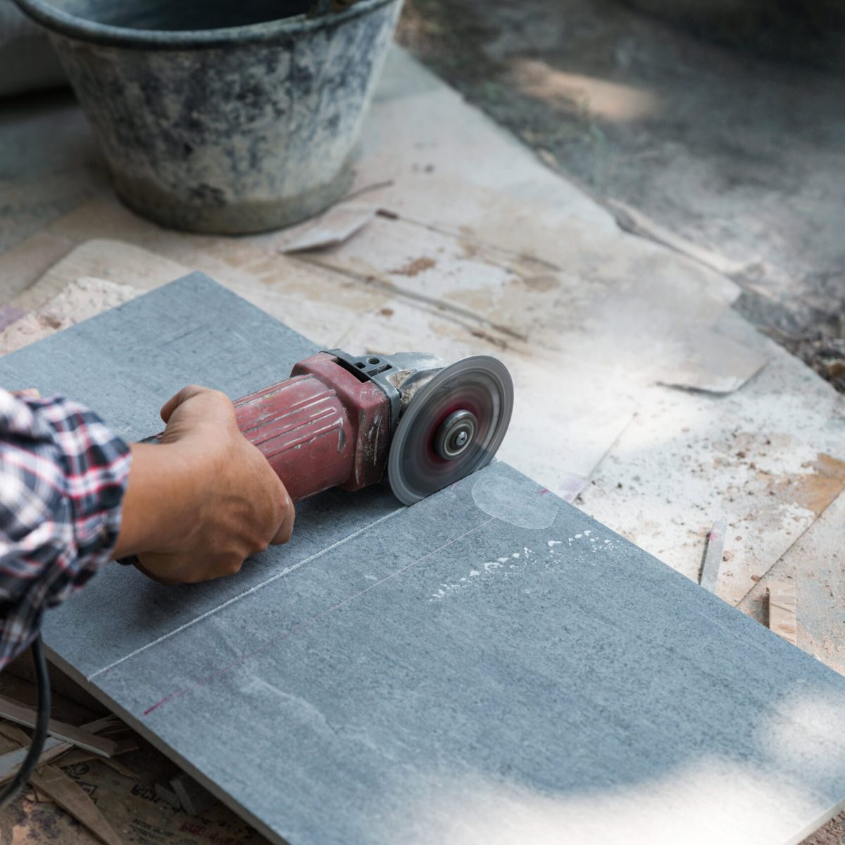 worker-using-electric-circular-saw-cutting-tile-in-2025-03-26-18-09-31-utc